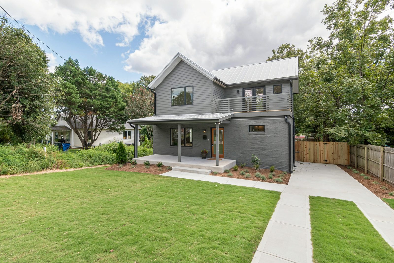 Modern Franklin home with a freshly mowed, edged front lawn